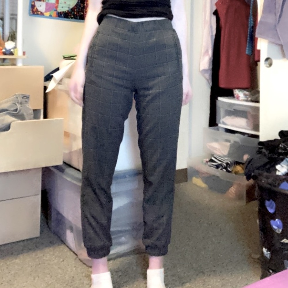 Dark plaid trousers
